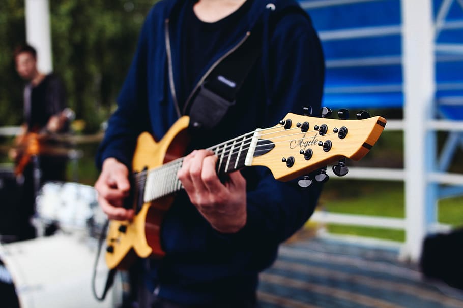 This image has an empty alt attribute; its file name is man-male-guitar-instrument.jpg